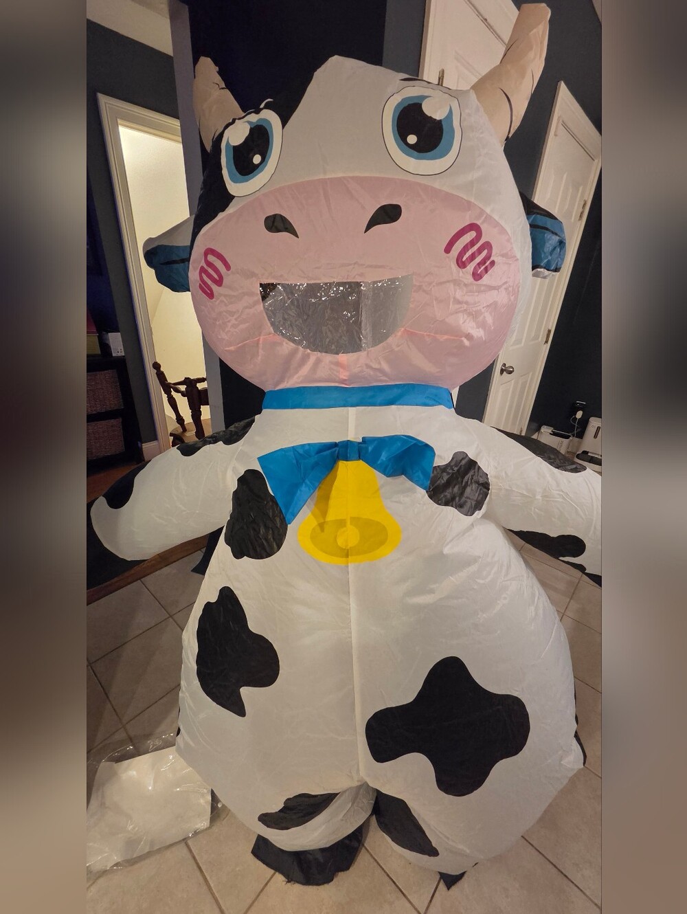 Adult Size Inflatable Cow Costume - White and Black With Blue Bow